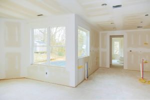 Under construction interior showcasing expert drywall installation, before the final touches are applied.